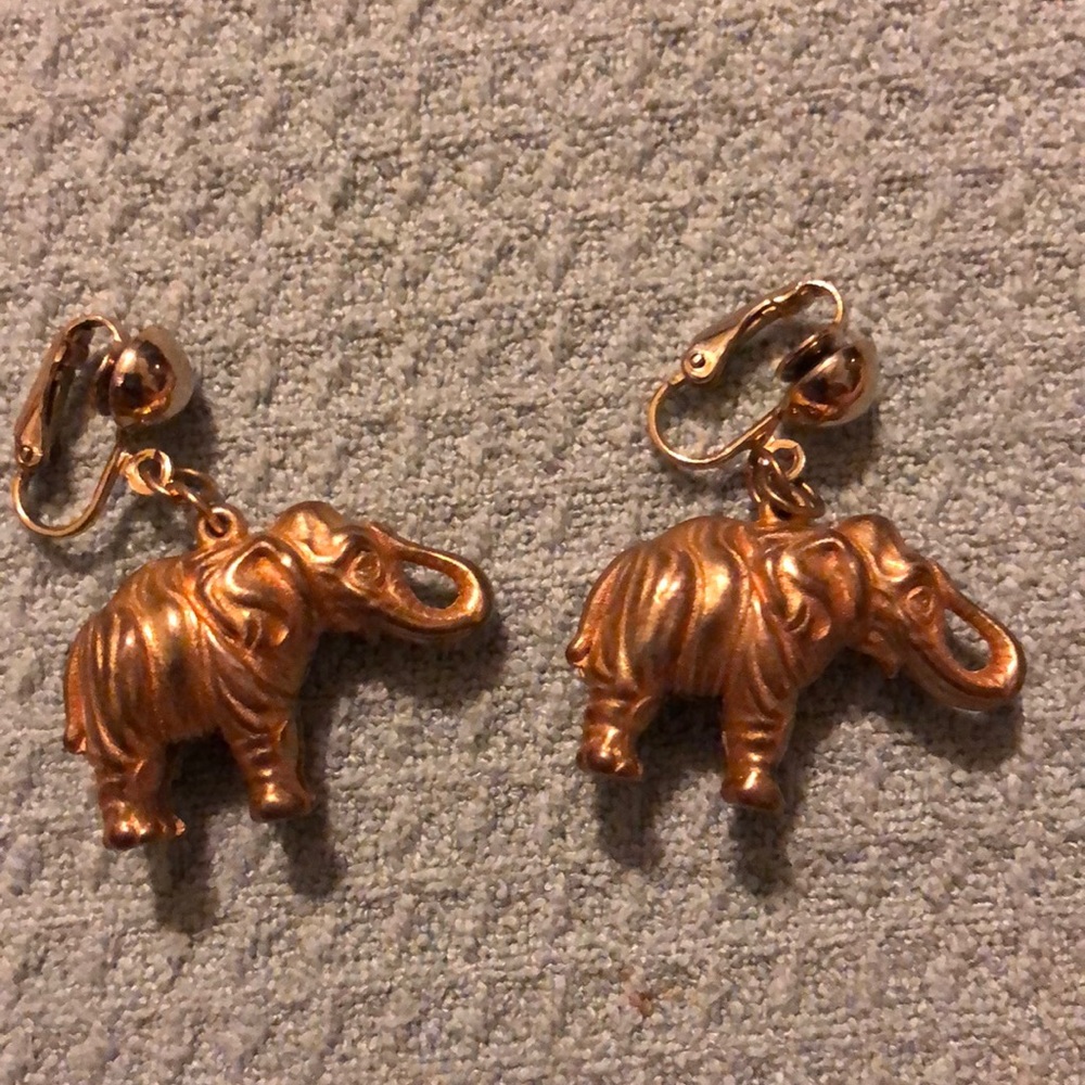 Gold tone elephant clip on earrings